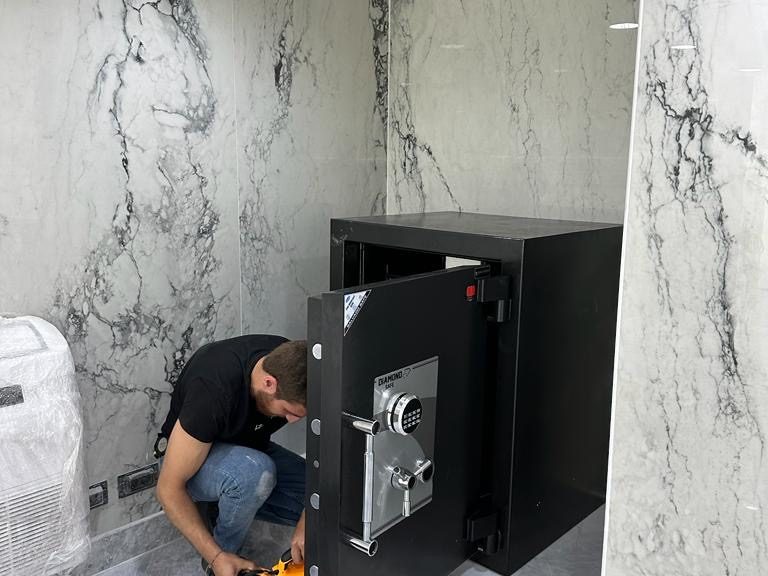 Salvado technician installing a vault door