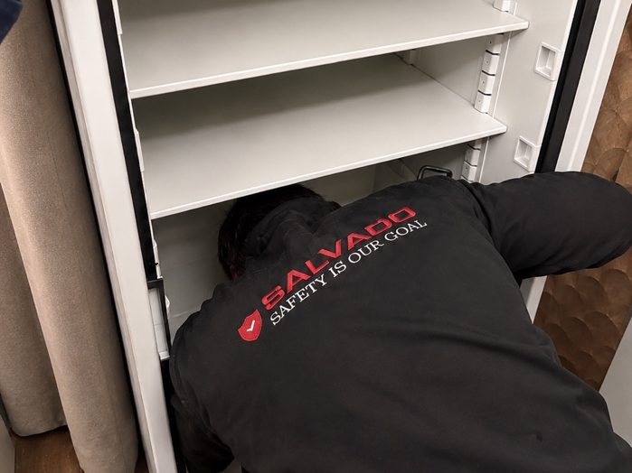 Salvado technician servicing the interior of a safe